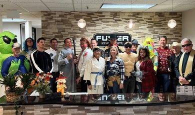 Group photo of the Fuller staff wearing costumes. Halloween Party 2022